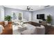 Stylish living room with modern furniture, hardwood floors, and lots of natural light at 1441 Cahaba Sw Dr, Atlanta, GA 30311