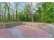 Backyard view featuring an outdoor patio with brick flooring and brick wall at 1441 Cahaba Sw Dr, Atlanta, GA 30311