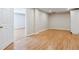 Spacious basement area with laminate flooring, neutral paint, and a storage closet at 2500 Kingsbrooke Ln, Duluth, GA 30097