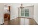 Elegant dining room with chandelier, large windows, and view into kitchen at 2500 Kingsbrooke Ln, Duluth, GA 30097