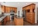Modern kitchen with stainless steel appliances, granite counters, and custom wood cabinetry at 2500 Kingsbrooke Ln, Duluth, GA 30097