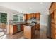 Well-lit kitchen with granite countertops, stainless steel appliances, and ample cabinet space at 2500 Kingsbrooke Ln, Duluth, GA 30097