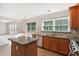 Spacious kitchen with a center island, granite countertops, and stainless steel appliances at 2500 Kingsbrooke Ln, Duluth, GA 30097