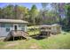 Relaxing backyard featuring a covered hot tub and outdoor space, ideal for entertainment at 537 Craven Rd, Roopville, GA 30170