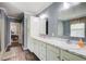 Bathroom featuring double sinks, ample cabinet space, and modern finishes for a functional design at 537 Craven Rd, Roopville, GA 30170