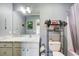 Neutral bathroom features a stylish vanity with marble counter and ample storage at 537 Craven Rd, Roopville, GA 30170