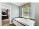 Soaking tub in a primary bathroom with a large window offering natural light, creating a spa-like atmosphere at 537 Craven Rd, Roopville, GA 30170