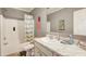 Well-lit bathroom featuring a vanity with marble countertop and a shower/tub combo at 537 Craven Rd, Roopville, GA 30170