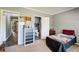 Cozy bedroom featuring a comfortable bed, a dresser and an ensuite bathroom at 537 Craven Rd, Roopville, GA 30170