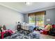 Cozy bedroom with natural light, creating a relaxing and comfortable space at 537 Craven Rd, Roopville, GA 30170