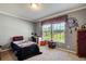 Bright bedroom with a window view, creating a serene environment for relaxation and sleep at 537 Craven Rd, Roopville, GA 30170
