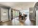 Open-concept dining area with a chandelier, lots of natural light, and views into the modern kitchen at 537 Craven Rd, Roopville, GA 30170