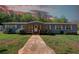Charming single-story home with well-maintained lawn, landscaping and a welcoming entrance at 537 Craven Rd, Roopville, GA 30170