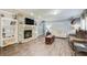 Spacious living room showcases a stone fireplace, built-in shelving, and hardwood floors at 537 Craven Rd, Roopville, GA 30170