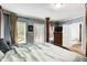 Bright main bedroom featuring a four-poster bed, ensuite bath and outdoor access at 537 Craven Rd, Roopville, GA 30170