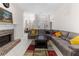 Large sectional sofa in an inviting living room leading to the dining area and main entrance at 5494 White Cedar Ter, Sugar Hill, GA 30518