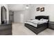 Well-appointed main bedroom with modern furnishings, including a dresser and a plush bed, for a restful and stylish space at 5494 White Cedar Ter, Sugar Hill, GA 30518