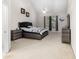 Serene main bedroom with high ceilings, a ceiling fan, and contemporary furnishings for a comfortable and stylish retreat at 5494 White Cedar Ter, Sugar Hill, GA 30518