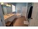 Clean bathroom with double vanity, soaking tub, and separate shower at 4118 Sandy Branch Dr, Buford, GA 30519