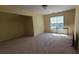 Bright bedroom with neutral walls, plush carpet, and natural light at 4118 Sandy Branch Dr, Buford, GA 30519