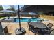 Inviting backyard pool area featuring umbrellas, a patio table, and comfortable seating at 4118 Sandy Branch Dr, Buford, GA 30519