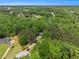 Scenic aerial view of homes near lush wooded areas, offering a blend of nature and neighborhood charm at 135 Fiddle Crk, Social Circle, GA 30025