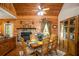 Dining area with a wood table, stone fireplace and hardwood floors, great for entertaining at 135 Fiddle Crk, Social Circle, GA 30025