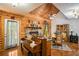 Charming dining room with vaulted ceilings, stone fireplace, and access to the outdoor patio at 135 Fiddle Crk, Social Circle, GA 30025