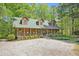 Charming home with a covered porch, dormer windows, and a meticulously landscaped front yard at 135 Fiddle Crk, Social Circle, GA 30025