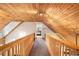 Upstairs hallway with wood ceiling shows access to other rooms at 135 Fiddle Crk, Social Circle, GA 30025