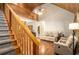 Bright living room with vaulted ceilings, hardwood floors, staircase and comfortable seating at 135 Fiddle Crk, Social Circle, GA 30025
