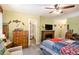 Bright bedroom with green walls and attached bathroom with a claw foot tub at 135 Fiddle Crk, Social Circle, GA 30025
