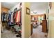 View from walk-in closet looking into log-walled main bedroom at 135 Fiddle Crk, Social Circle, GA 30025