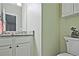 Clean bathroom featuring vanity with granite countertop, offering a fresh and functional space at 2557 Summit Cove Dr # 128, Duluth, GA 30097