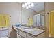 Bathroom with granite countertop, large mirror, and overhead lighting at 2557 Summit Cove Dr # 128, Duluth, GA 30097