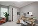 Neutral-toned bedroom designed as a home office, with large window and natural light at 2557 Summit Cove Dr # 128, Duluth, GA 30097