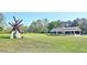 A well-maintained community park featuring green spaces, an art installation, and a picnic pavilion for outdoor enjoyment at 2557 Summit Cove Dr # 128, Duluth, GA 30097