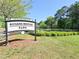 Rogers Bridge Park sign situated near green space and trees at 2557 Summit Cove Dr # 128, Duluth, GA 30097