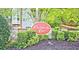Stone entrance to Chattahoochee Cove with lush landscaping at 2557 Summit Cove Dr # 128, Duluth, GA 30097