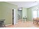 Bright dining area showcasing tile flooring, neutral walls, and views into the kitchen at 2557 Summit Cove Dr # 128, Duluth, GA 30097