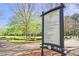 Rogers Bridge Dog Park rules, situated near green space and trees at 2557 Summit Cove Dr # 128, Duluth, GA 30097