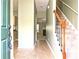 Welcoming foyer featuring hardwood floors, staircase, and a glimpse into the living spaces at 2557 Summit Cove Dr # 128, Duluth, GA 30097