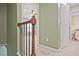 Hallway with carpet and railing, leading to other rooms in the house at 2557 Summit Cove Dr # 128, Duluth, GA 30097