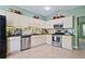 Bright kitchen with stainless steel appliances, and light colored cabinets at 2557 Summit Cove Dr # 128, Duluth, GA 30097