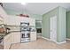 Well-lit kitchen with stainless appliances and bright cabinets, offering a modern aesthetic at 2557 Summit Cove Dr # 128, Duluth, GA 30097