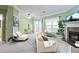 Bright living room boasts fireplace, fan, and neutral tones that create a cozy and inviting atmosphere at 2557 Summit Cove Dr # 128, Duluth, GA 30097