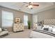 Spacious main bedroom with ceiling fan, tray ceiling, and plenty of natural light at 2557 Summit Cove Dr # 128, Duluth, GA 30097