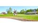 Expansive park with green lawns, walking paths, pavilions, and scenic views, perfect for outdoor recreation at 2557 Summit Cove Dr # 128, Duluth, GA 30097