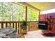 Outdoor patio perfect for grilling, with a dining set and lounge chair for relaxation at 2557 Summit Cove Dr # 128, Duluth, GA 30097