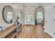 Inviting foyer with hardwood floors, high ceilings, arched doorways, and natural light at 2850 Dartmouth Pl, Cumming, GA 30041